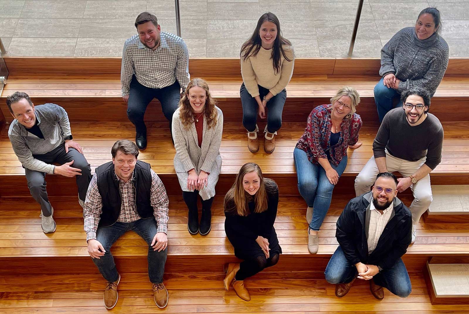 An aerial shot of Kansas Leadership Center staff, 10 people sitting on bleachers.