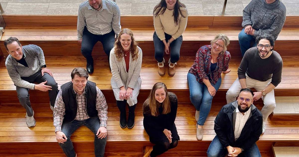 An aerial shot of Kansas Leadership Center staff, 10 people sitting on bleachers.