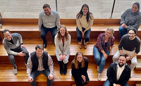 An aerial shot of Kansas Leadership Center staff, 10 people sitting on bleachers.