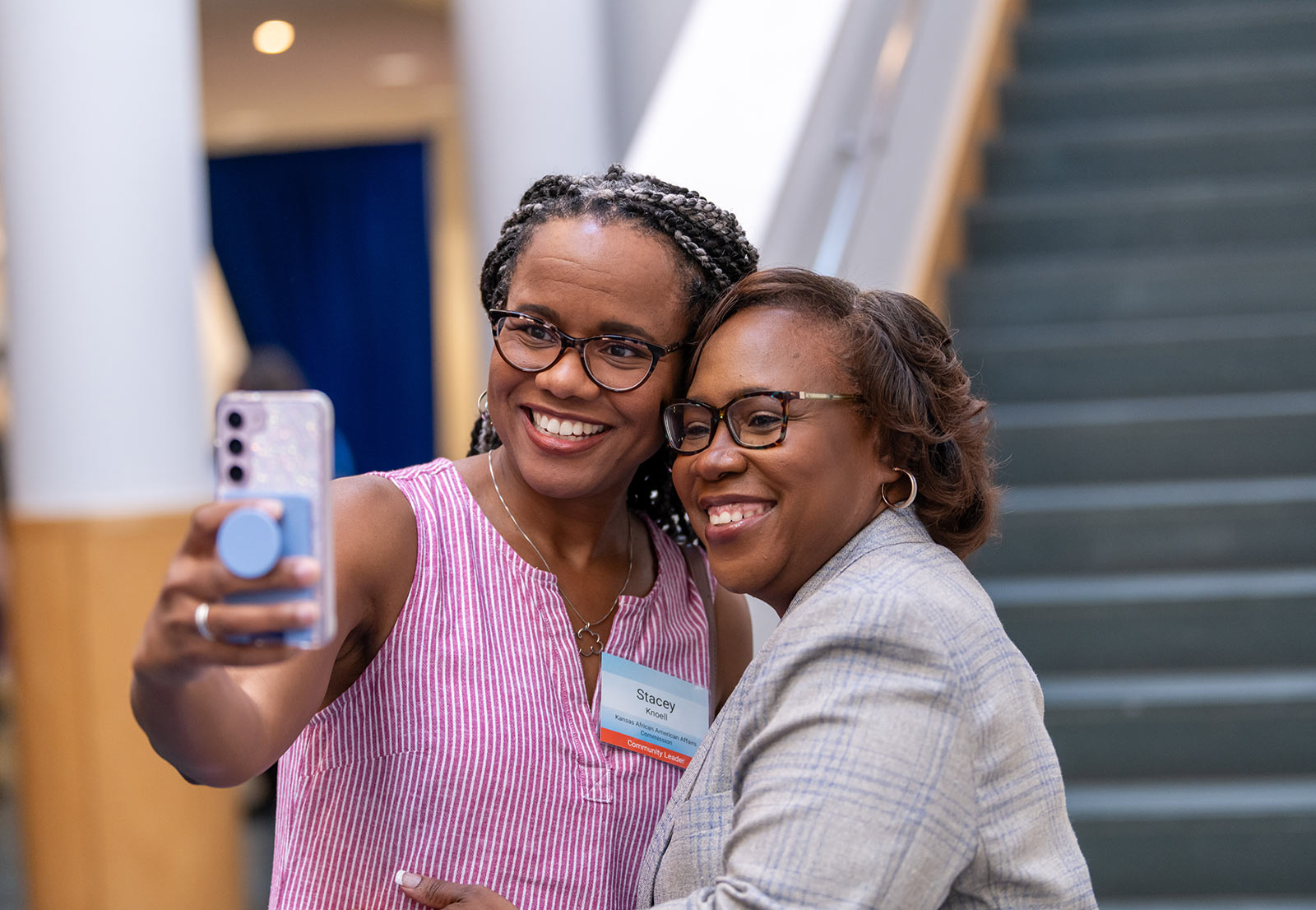 Dr. DeAngela Burns-Wallace greets community members at the end of the blue carpet at the Kauffman Foundation's Open House event Sept. 28, 2023.