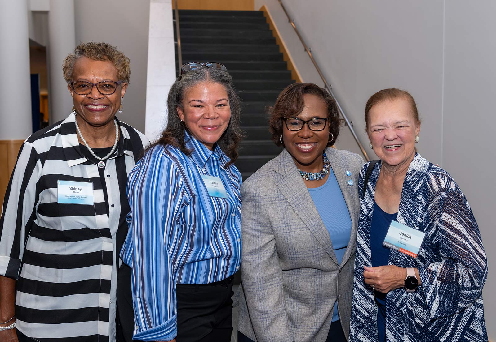 Dr. DeAngela Burns-Wallace greets community members at the end of the blue carpet at the Kauffman Foundation's Open House event Sept. 28, 2023.