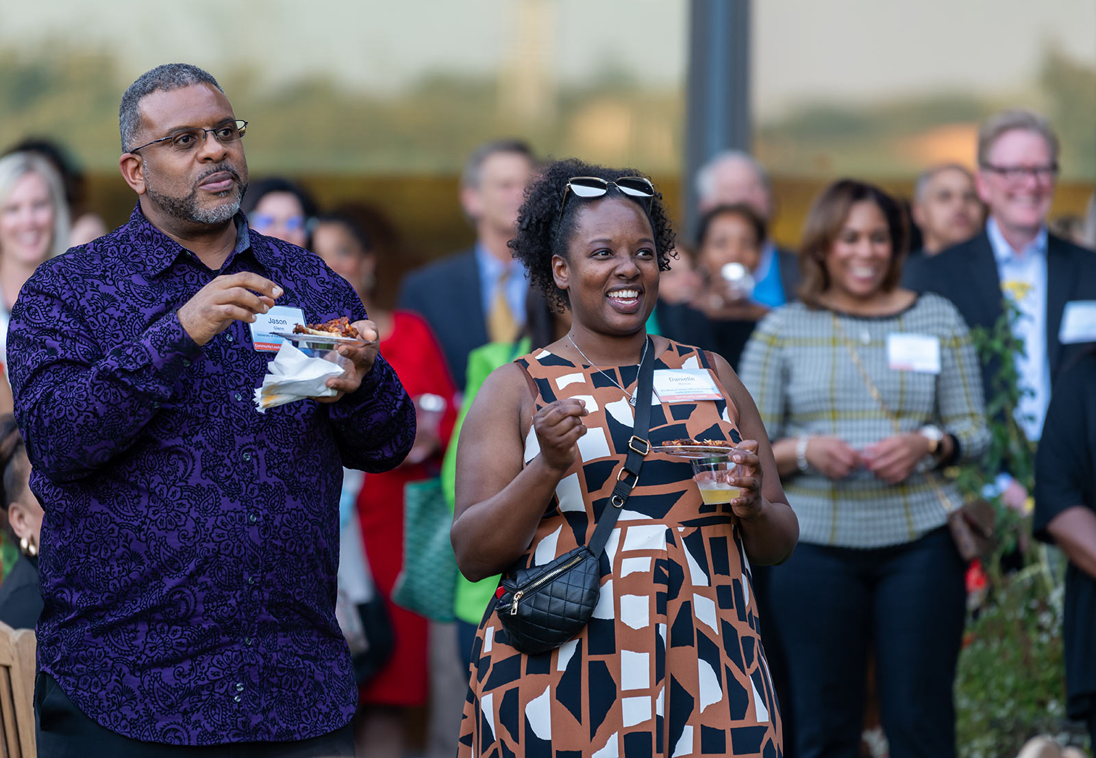 Community members gather in the Kauffman Foundation courtyard during Dr. DeAngela Burns-Wallace's remarks at the Open House event Sept. 28, 2023.