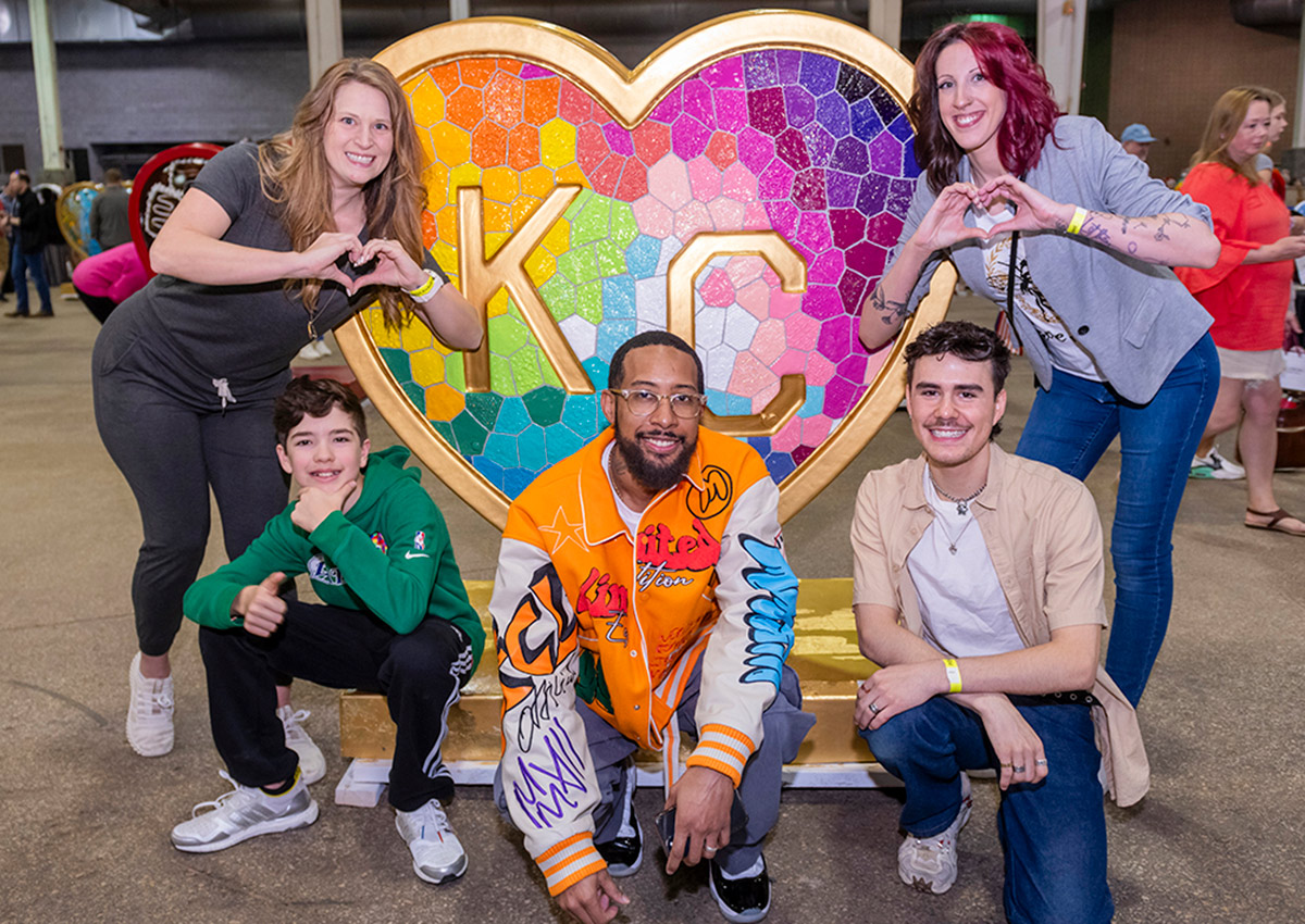 Parade of Hearts artists pose in front of 'Takes Heart' by Laura Noll Crossley at the American Royal Governor's Expo event on April 13.