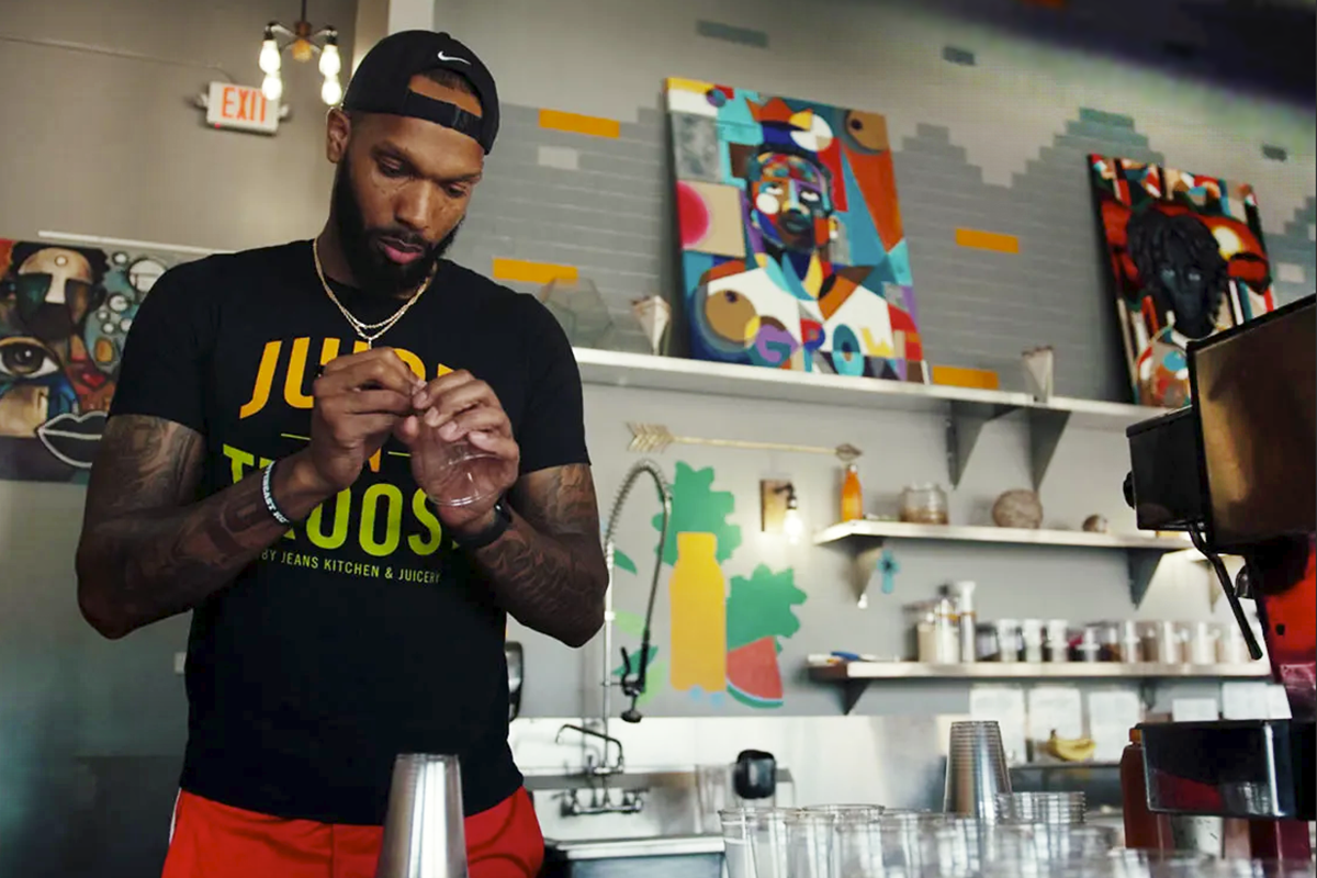 A business owner prepares for his shop to open