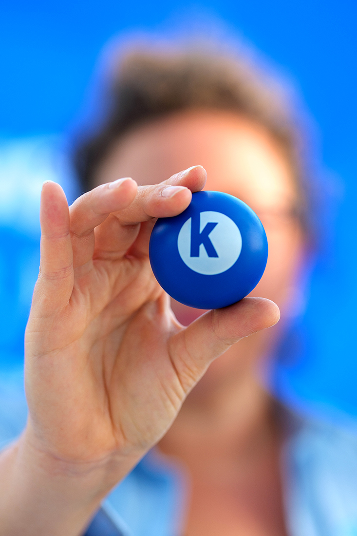 A close-up of the Kauffman Foundation branded bouncy ball that TEDxKC attendees wrote on during the event