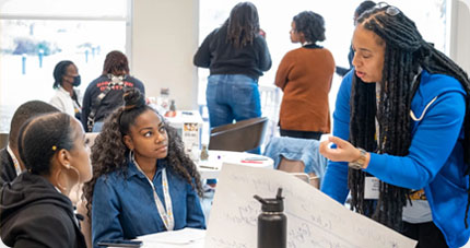 Collaboration around a small table.