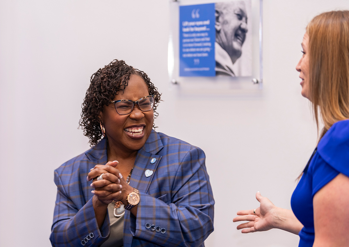 Dr. DeAngela Burns-Wallace greets a community member at the Ewing Marion Kauffman Foundation Spark Open House event