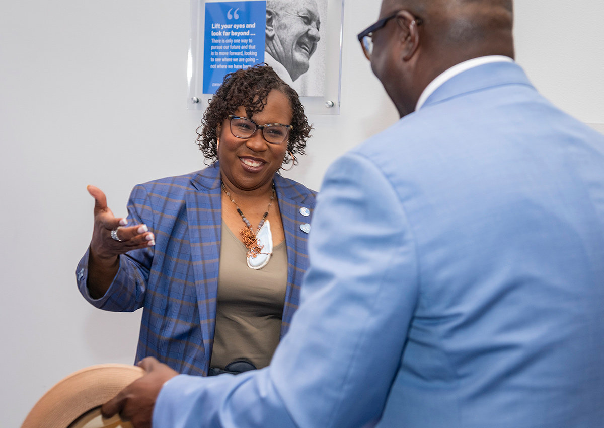 Dr. DeAngela Burns-Wallace greets community members at the Ewing Marion Kauffman Foundation Spark Open House event