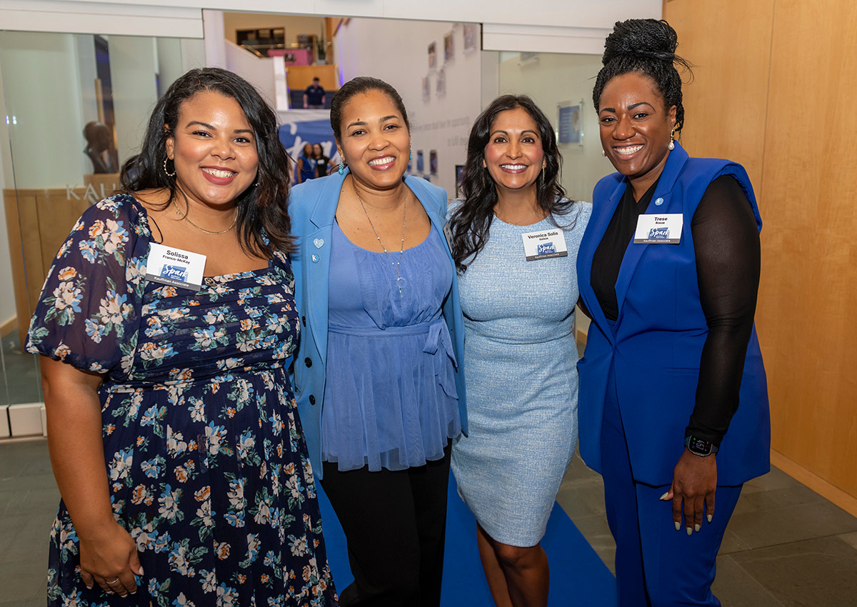 Solissa Franco-McKay, Miles Sandler, Veronica Solis-Galicia, and Trese Booze pose for a photo at the Ewing Marion Kauffman Foundation Spark Open House event